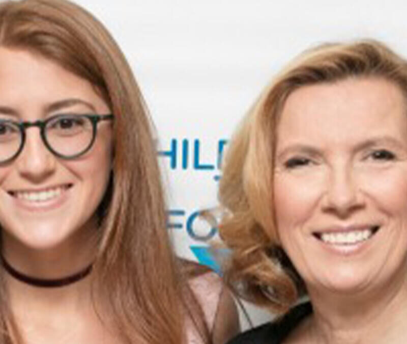 Two women posing for a photo at a phillips foundation event.