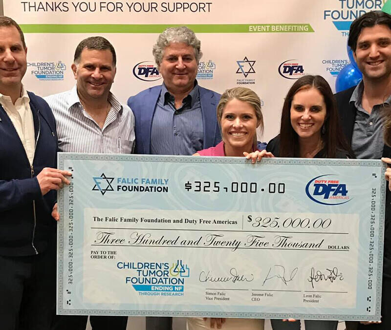 A group of people posing with a check.