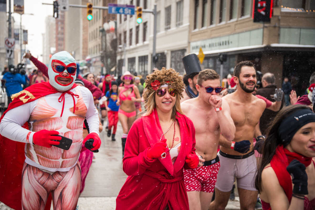 men and women running in their underwear and robes