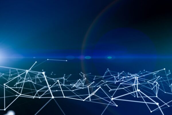 Abstract image of a network of interconnected lines and nodes against a blue background with a light flare.