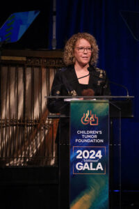 Person speaking at a podium during the Children's Tumor Foundation 2024 National Gala.