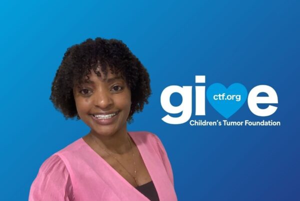 Person smiling in front of a blue background with the text "give ctf.org Children's Tumor Foundation" to the right.