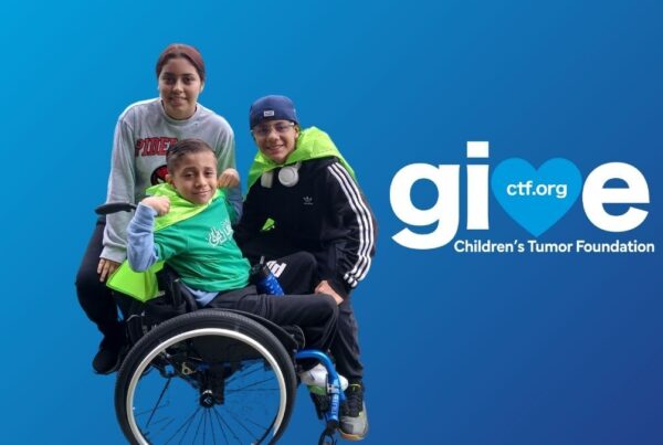 Three people smiling, with one in a wheelchair. They wear green capes. The image has a blue background with the Children's Tumor Foundation logo.