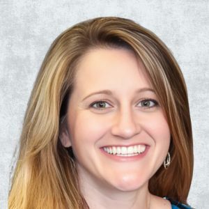 A woman with long, light brown hair is smiling at the camera against a gray background.