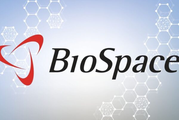 BioSpace logo featuring a red triangular symbol and black text, set against a light background with abstract hexagonal patterns.